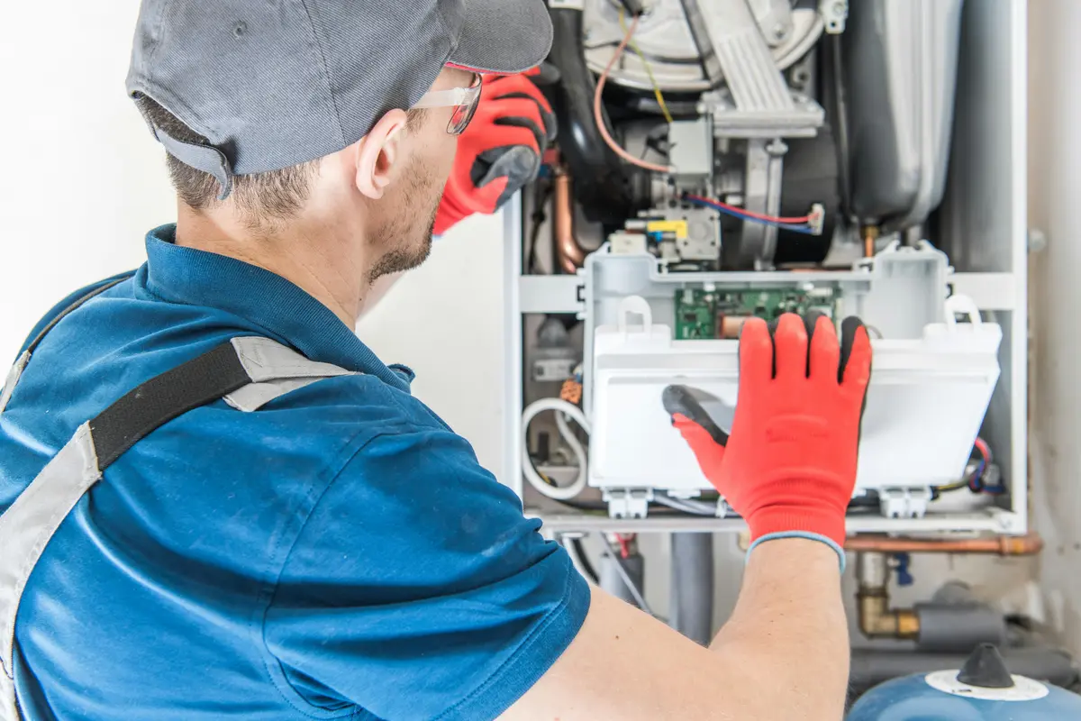 HVAC technician performing annual maintenance on a boiler in Vancouver