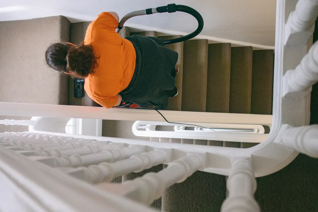 Duct cleaning technician with HEPA vacuum in Vancouver