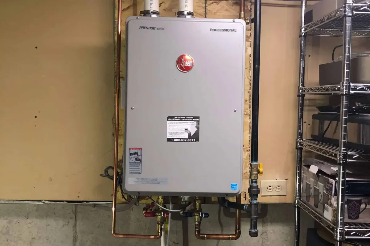 Rheem tankless water heater installed on a wall in a Vancouver basement